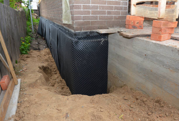 Happy homeowners after waterproofing job in New Prague
